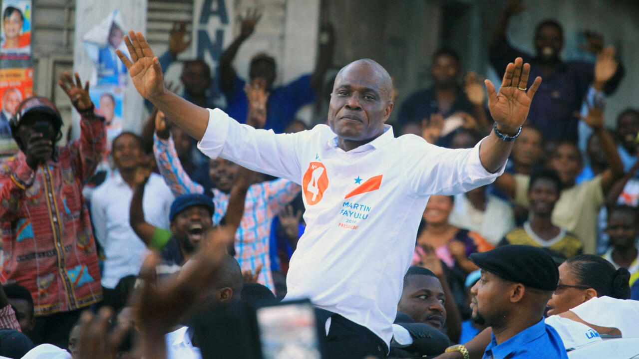 Congolese joint opposition Presidential candidate Martin Fayulu waves to supporters as he campaigns in Goma
